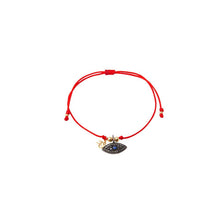 Red string bracelet with solitary silver God eye