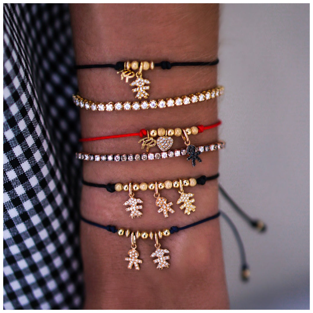 Red string bracelet with boy and heart charms